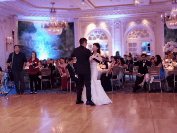 A couple is dancing in front of an audience.