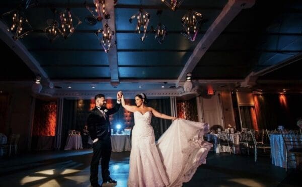A bride and groom are dancing on the dance floor.